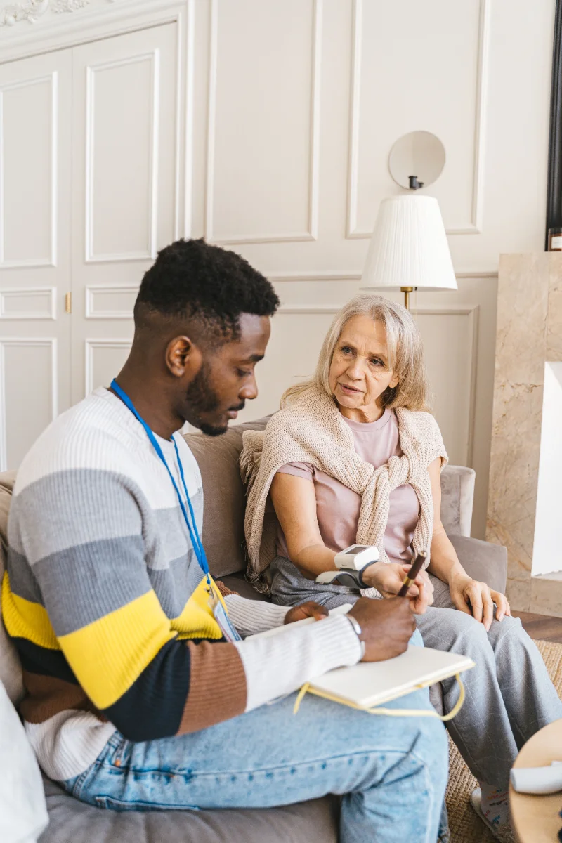 Caregiver supporting patient with mobility